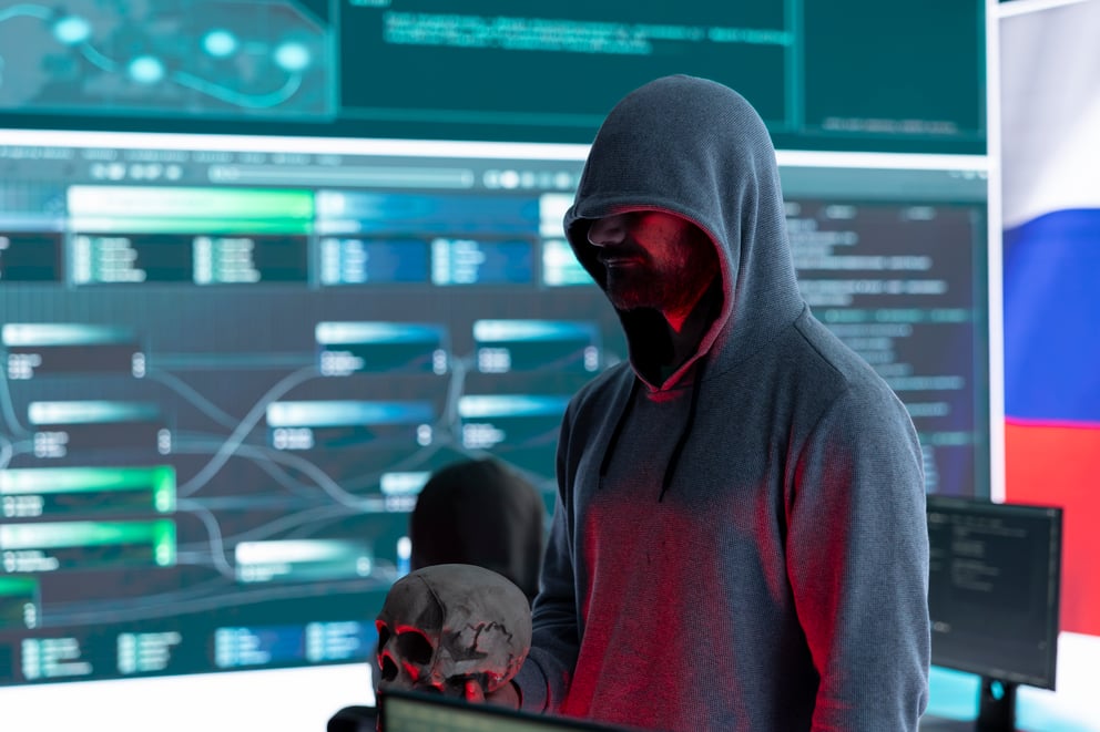 https://sibermate.com/hubfs/digital-outlaw-hacker-dark-hood-issuing-cyber-threats-with-human-skull-2.jpg