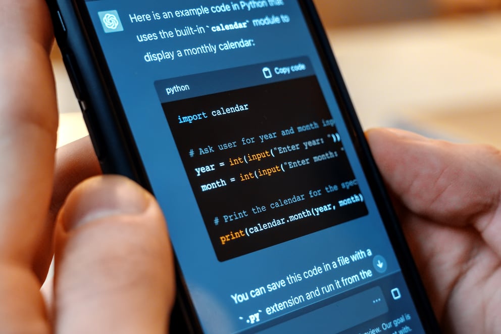 https://sibermate.com/hubfs/smartphone-with-opened-ai-chat-it.jpg